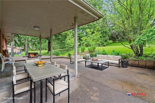view of patio / terrace with an outdoor living space and outdoor dining area