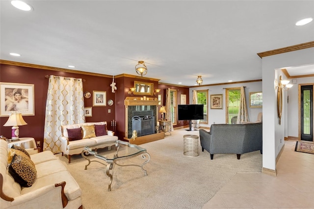 carpeted living area featuring recessed lighting, crown molding, baseboards, a premium fireplace, and tile patterned floors