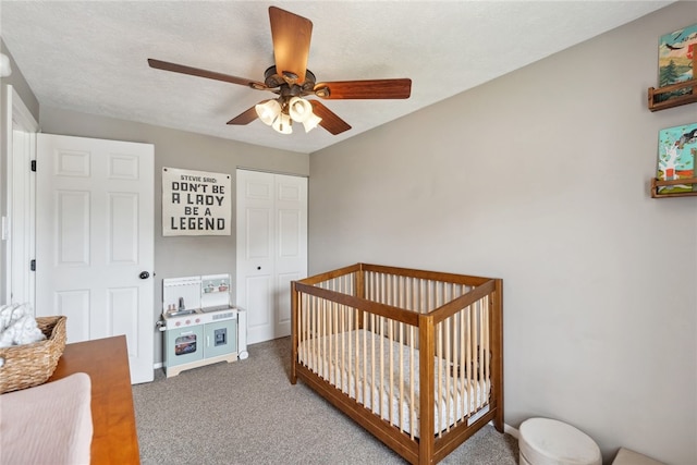 112 Cranbrooke Dr, Findlay Twp, PA 15108 - carpeted bedroom featuring a closet, a nursery area, ceiling fan, and baseboards