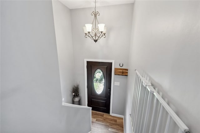 112 Cranbrooke Dr, Findlay Twp, PA 15108 - foyer entrance featuring wood finished floors, a chandelier, and baseboards