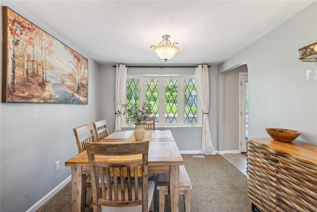 112 Cranbrooke Dr, Findlay Twp, PA 15108 - carpeted dining room featuring arched walkways and baseboards