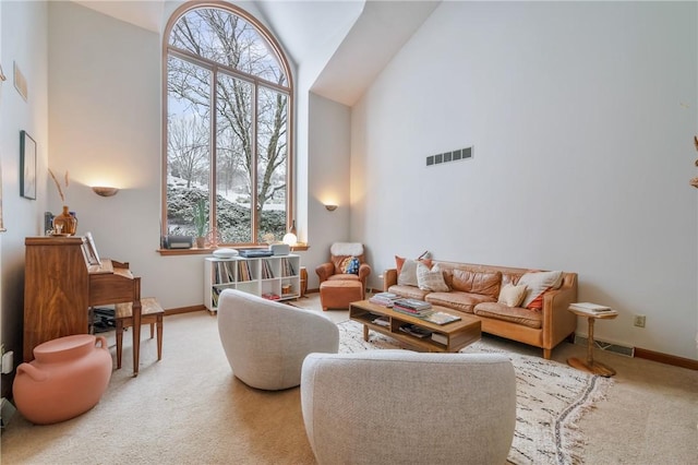 4616 Windbrook, Murrysville, PA 15668 - carpeted living area featuring high vaulted ceiling, plenty of natural light, and baseboards