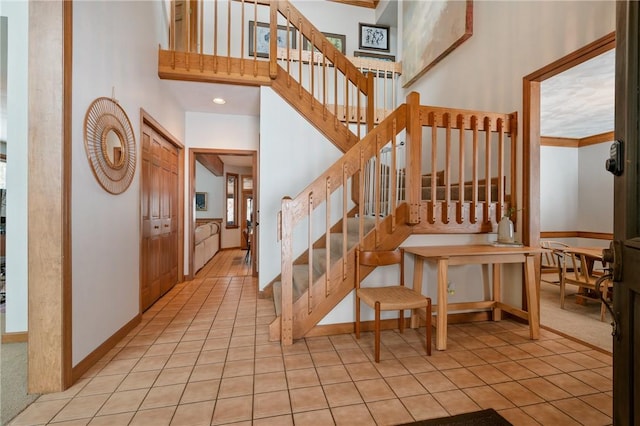 4616 Windbrook, Murrysville, PA 15668 - stairway featuring a high ceiling and tile patterned floors