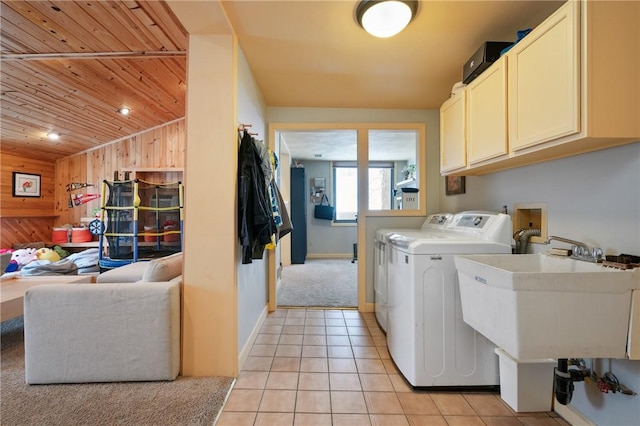 4616 Windbrook, Murrysville, PA 15668 - clothes washing area with cabinet space, wooden ceiling, washer and dryer, wooden walls, and light tile patterned flooring