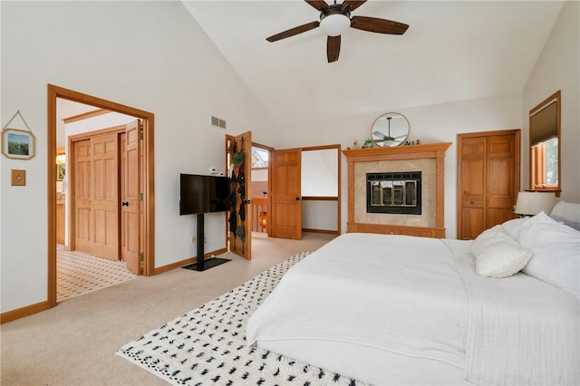 4616 Windbrook, Murrysville, PA 15668 - bedroom with baseboards, light colored carpet, high vaulted ceiling, a tiled fireplace, and ceiling fan