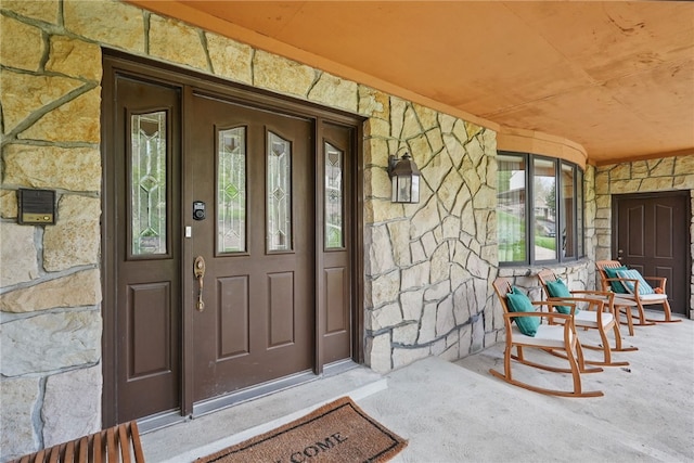 4616 Windbrook, Murrysville, PA 15668 - view of exterior entry featuring stone siding and a porch