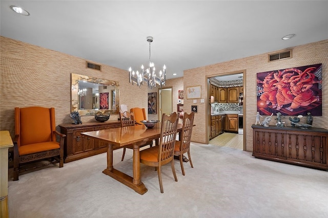 dining room with light colored carpet, a chandelier, and recessed lighting