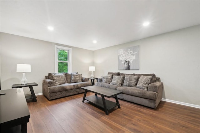 living area with wood finished floors, baseboards, and recessed lighting
