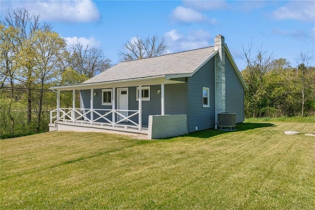 view of outbuilding featuring covered porch and central AC unit