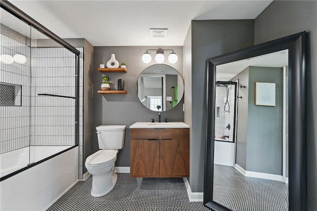 113 Lewisham Rd, Cranberry Twp, PA 16066 - bathroom with toilet, tile patterned flooring, baseboards, vanity, and combined bath / shower with glass door