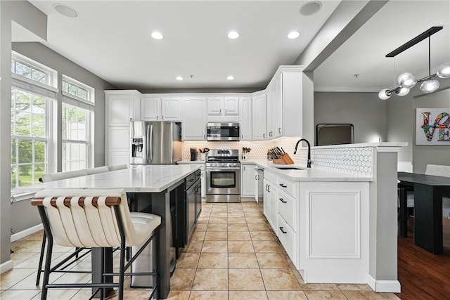 113 Lewisham Rd, Cranberry Twp, PA 16066 - kitchen with appliances with stainless steel finishes, a sink, tasteful backsplash, white cabinetry, and recessed lighting