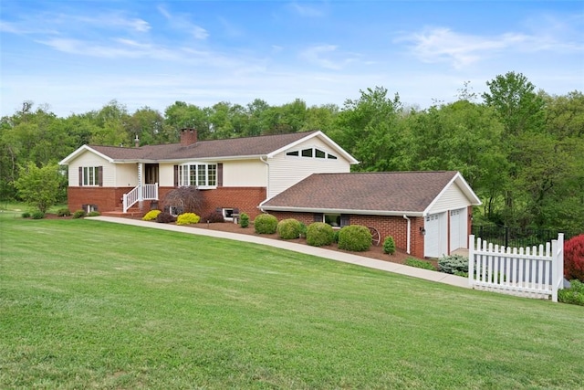 view of front of home with brick siding, a chimney, and a garage