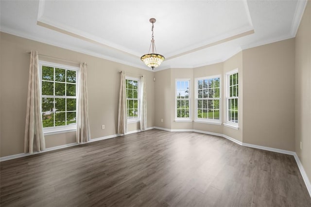 939 White Water Dr, Adams Twp, PA 16046 - spare room featuring a tray ceiling, dark wood-type flooring, ornamental molding, baseboards, and a chandelier