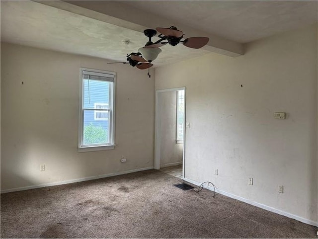 unfurnished room featuring carpet flooring, ceiling fan, and baseboards
