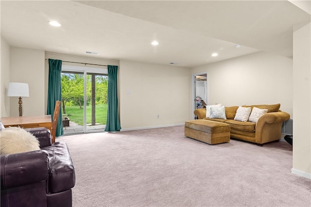 carpeted living area featuring recessed lighting and baseboards