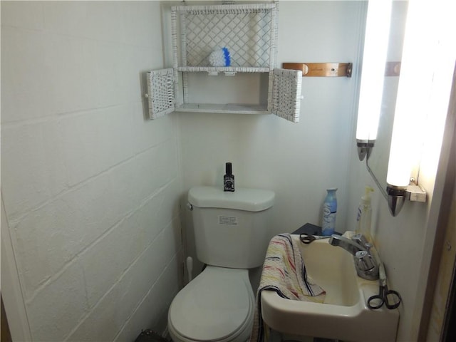bathroom featuring toilet and a sink