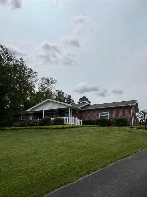 383 Bonniebrook Rd, Summit Twp But, PA 16002 - ranch-style house with a front yard, covered porch, and brick siding