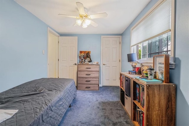 carpeted bedroom with ceiling fan