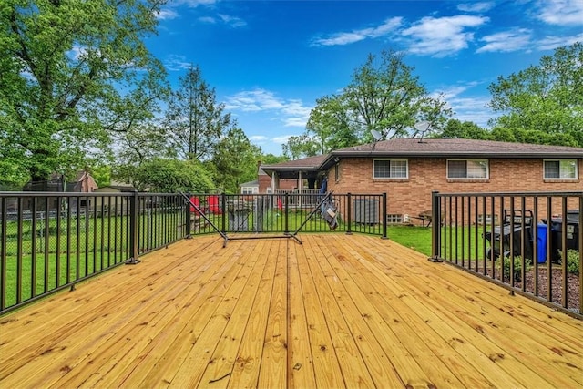 wooden terrace with a yard