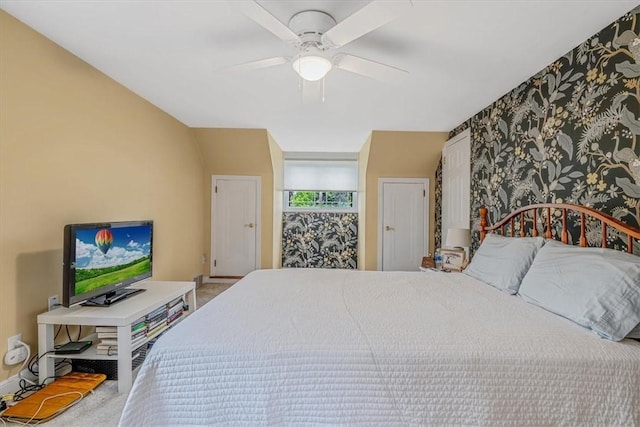 bedroom with carpet floors, a ceiling fan, and baseboards