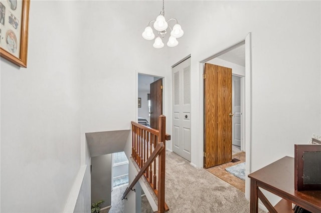 226 Green Ct, Castle Shannon, PA 15234 - hallway with an upstairs landing, carpet flooring, and a chandelier