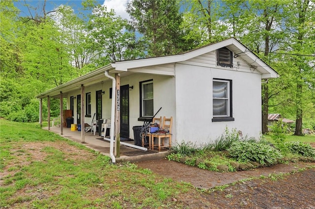 1770 Perry Hwy, Muddy Creek Twp, PA 16051 - view of side of home with stucco siding and a patio