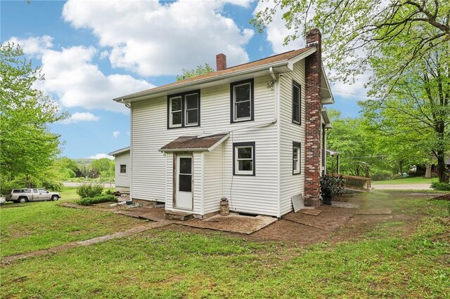1770 Perry Hwy, Muddy Creek Twp, PA 16051 - back of house with a chimney and a yard