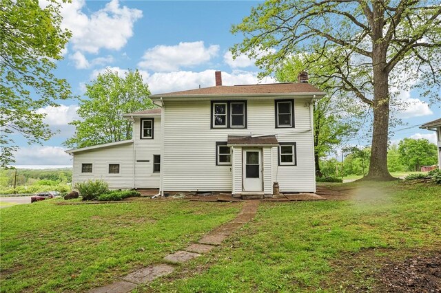 1770 Perry Hwy, Muddy Creek Twp, PA 16051 - back of house with a chimney and a yard