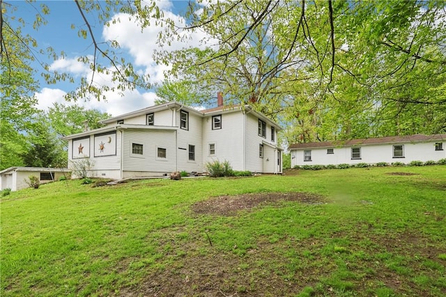 1770 Perry Hwy, Muddy Creek Twp, PA 16051 - back of property with a chimney and a yard