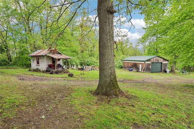1770 Perry Hwy, Muddy Creek Twp, PA 16051 - view of green lawn with a garage and an outdoor structure