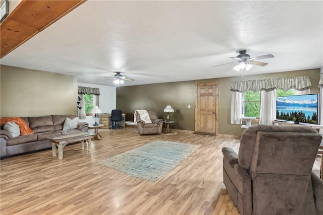 1770 Perry Hwy, Muddy Creek Twp, PA 16051 - living area featuring a ceiling fan, light wood-style floors, and plenty of natural light
