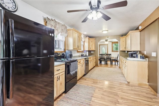 1770 Perry Hwy, Muddy Creek Twp, PA 16051 - kitchen featuring black appliances, light brown cabinets, a ceiling fan, a sink, and light wood-style flooring