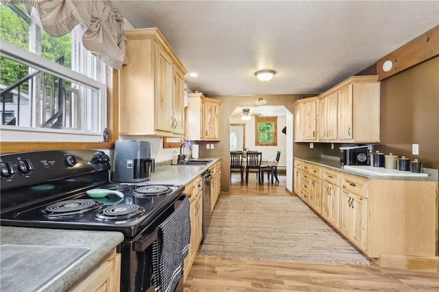 1770 Perry Hwy, Muddy Creek Twp, PA 16051 - kitchen featuring black electric range, light brown cabinetry, a sink, light wood-style floors, and dishwasher