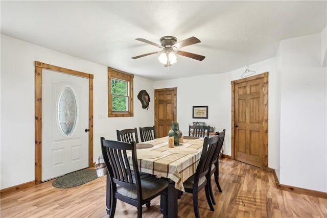 1770 Perry Hwy, Muddy Creek Twp, PA 16051 - dining room with baseboards, light wood finished floors, and ceiling fan
