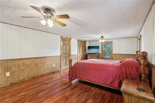 1770 Perry Hwy, Muddy Creek Twp, PA 16051 - bedroom featuring wood finished floors, wooden walls, wainscoting, and a ceiling fan