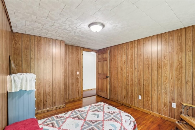 1770 Perry Hwy, Muddy Creek Twp, PA 16051 - bedroom with wooden walls, wood finished floors, and baseboards