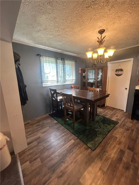 515 Green St, Saltsburg Area, PA 15681 - dining space with ornamental molding, a chandelier, a textured ceiling, and wood finished floors