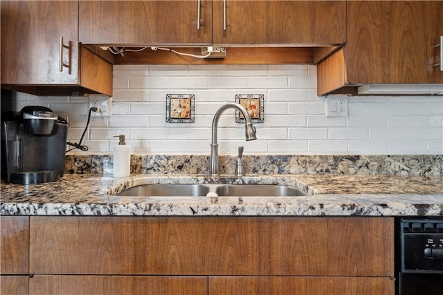 257 Penhurst Dr, Wilkins Twp, PA 15235 - kitchen with a sink, tasteful backsplash, light stone countertops, and brown cabinets