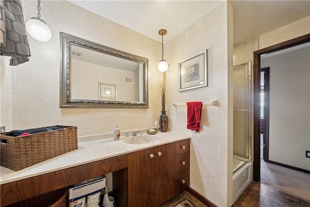 257 Penhurst Dr, Wilkins Twp, PA 15235 - bathroom featuring baseboards, vanity, wood finished floors, and shower / bath combination