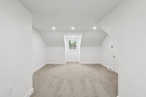bonus room featuring baseboards, carpet floors, recessed lighting, and lofted ceiling