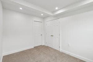 carpeted empty room with recessed lighting and baseboards