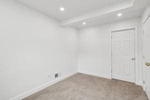 carpeted spare room with recessed lighting and baseboards