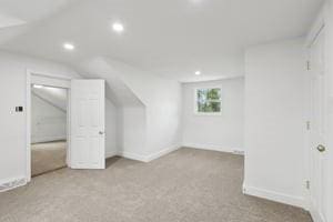bonus room with recessed lighting, baseboards, carpet floors, and vaulted ceiling