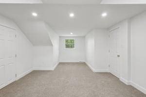 bonus room with recessed lighting, carpet, baseboards, and lofted ceiling