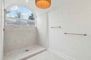 bathroom with tiled shower