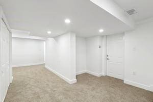 finished basement with recessed lighting, carpet, and baseboards