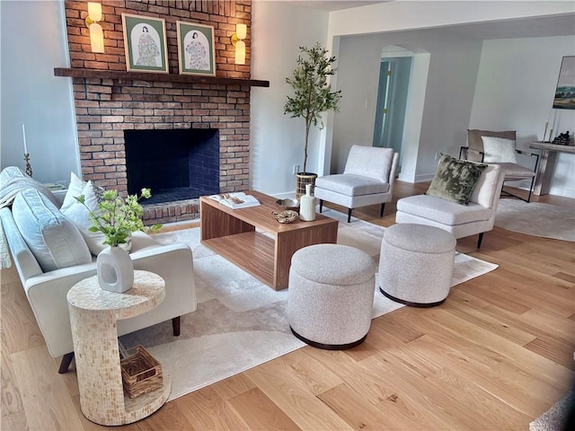 10 Neptune Dr, Robinson Twp Nwa, PA 15136 - living area featuring wood finished floors and a brick fireplace