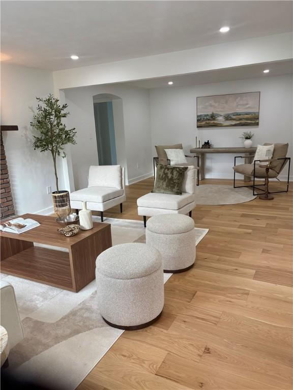 10 Neptune Dr, Robinson Twp Nwa, PA 15136 - sitting room with baseboards, light wood-type flooring, recessed lighting, and arched walkways