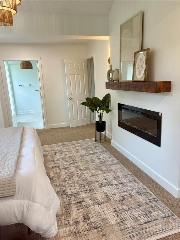 10 Neptune Dr, Robinson Twp Nwa, PA 15136 - bedroom with a glass covered fireplace, carpet, and baseboards