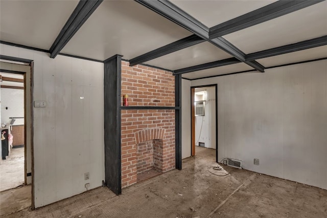 2252 Milligan Ave, Swissvale, PA 15218 - empty room featuring concrete flooring, a brick fireplace, and beam ceiling